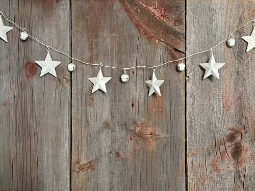star symbol silver star buntings on wood pallet wood
